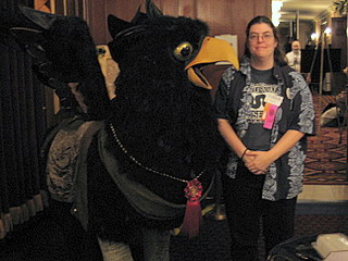 photograph of me standing next to griffin sculpture